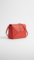 Geometric crossbody bag in coral red